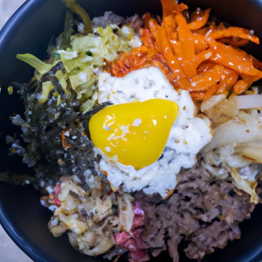 Bibimbap – tradiční korejské směsi rýže s masem a zeleninou