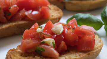 Česneková bruschetta s rajčaty a bazalkou